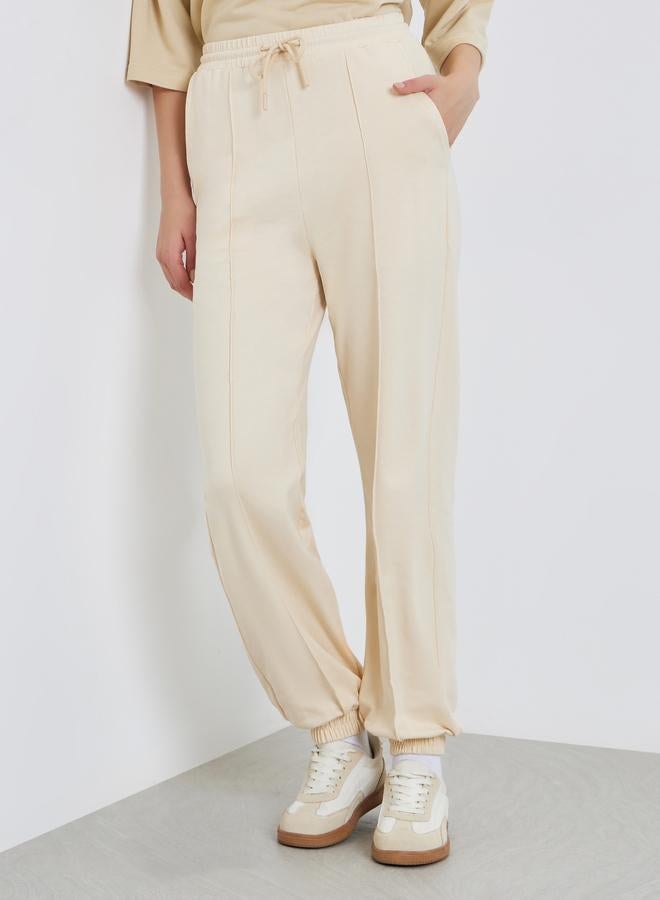 Styli Women Beige Tapered Joggers with Drawstring - Image 1